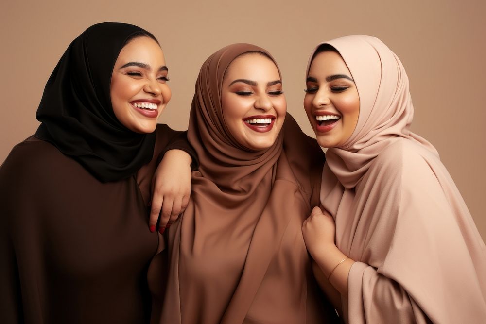 3 plus size Middle eastern women laughing smiling people.