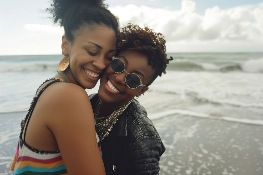 Two Afican American lgbtq at the beach together photography sunglasses portrait.