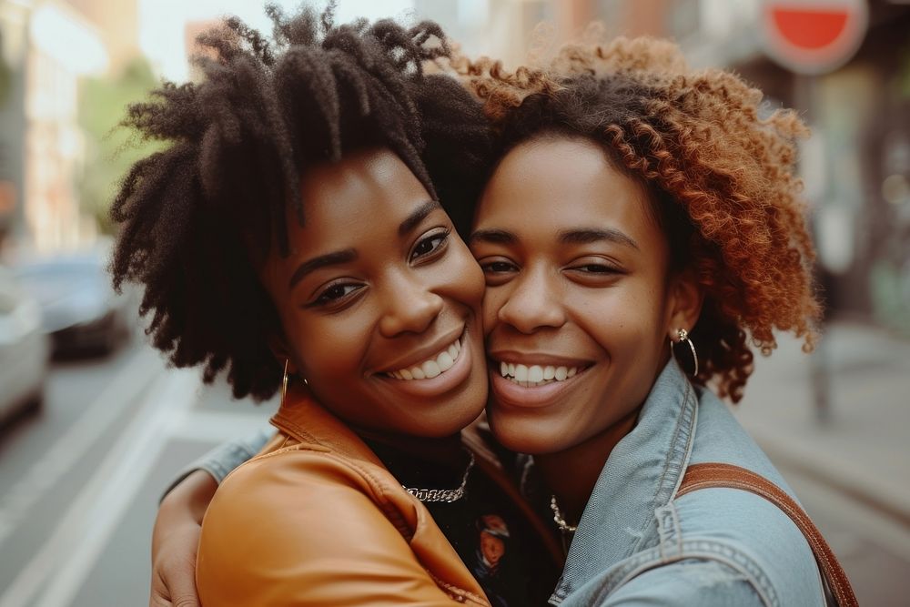 Two happy beautiful young African American lgbtq laughing smile adult.