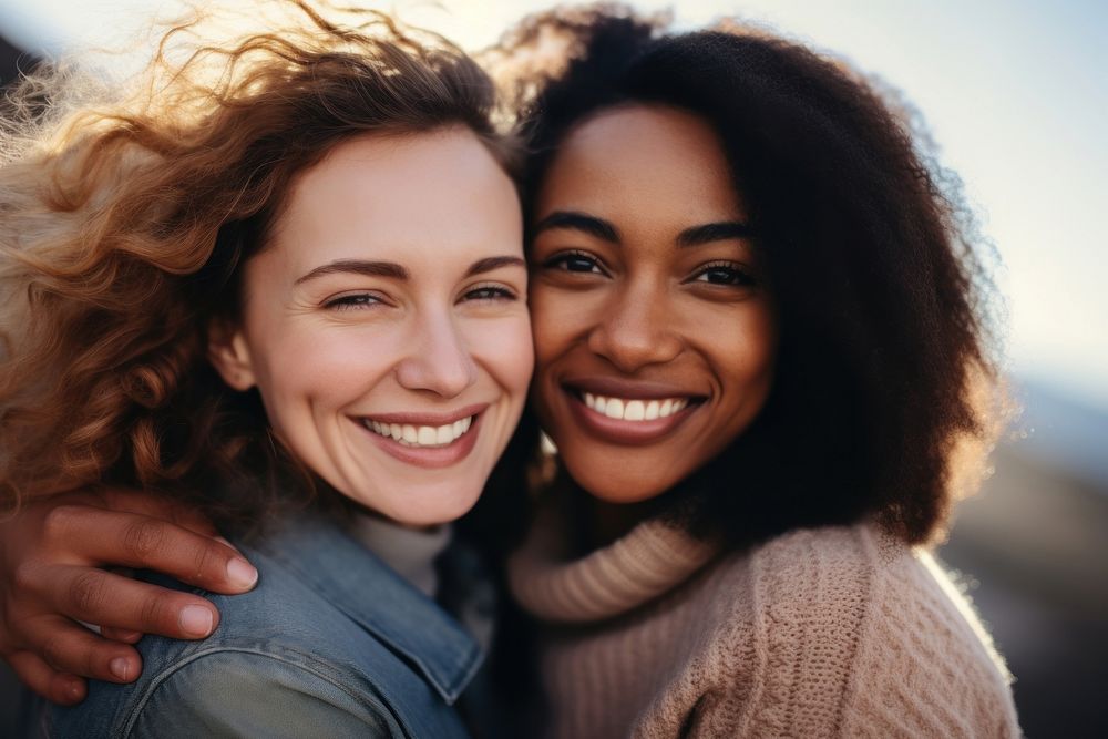 Mixed race women laughing portrait smiling.