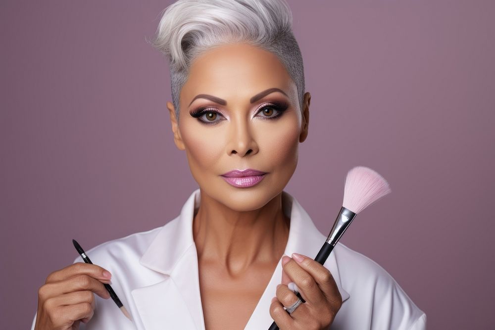 Middle aged multiracial woman doing her makeup cosmetics fashion individuality.