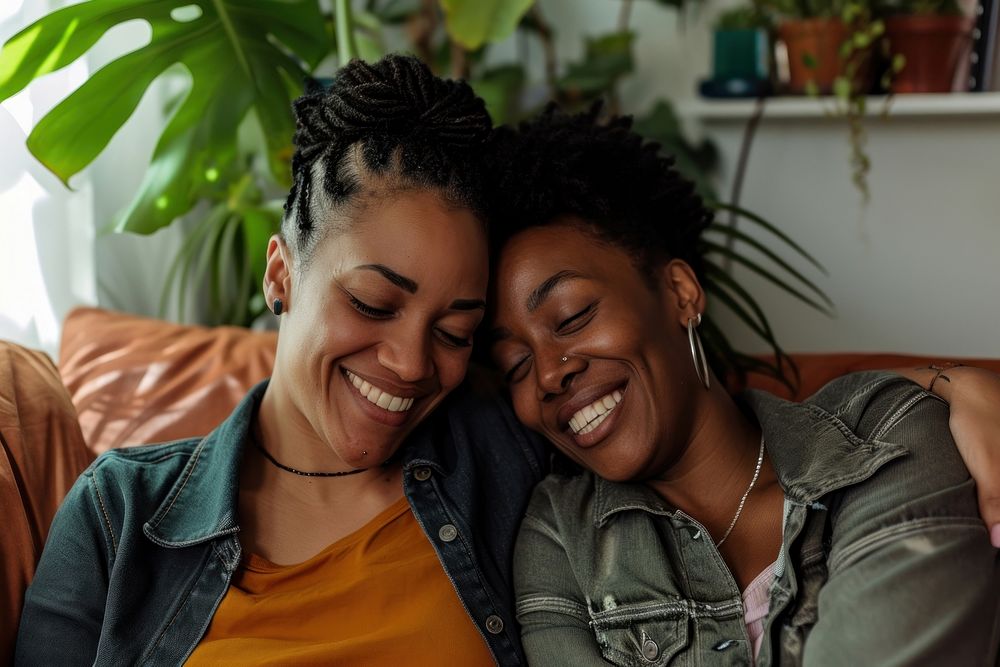 A couple of lgbt african american laughing smiling smile.