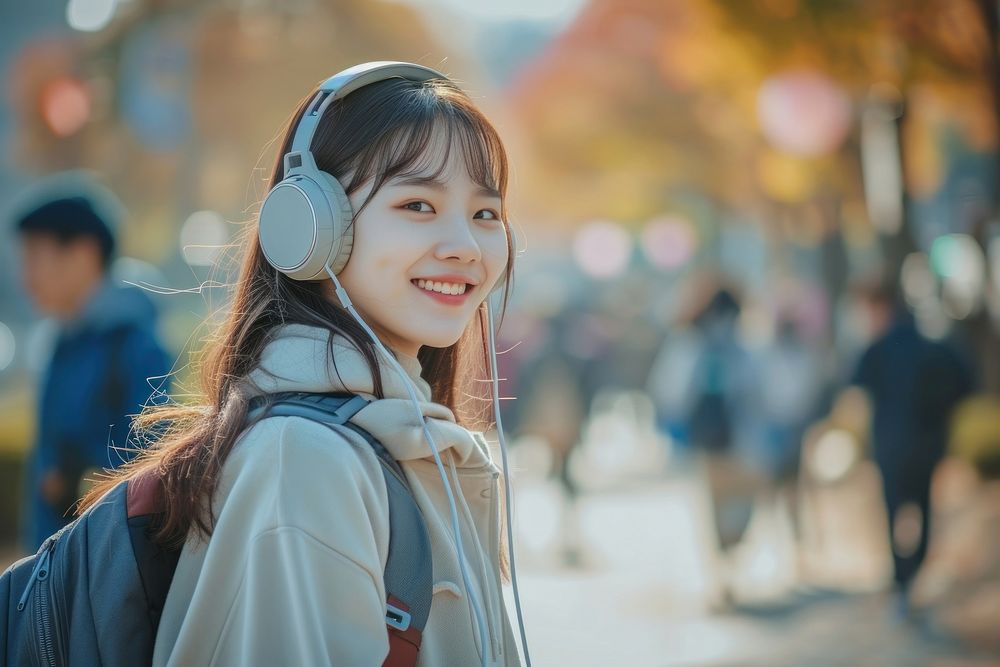 Korean student listening music headphones headset happy.