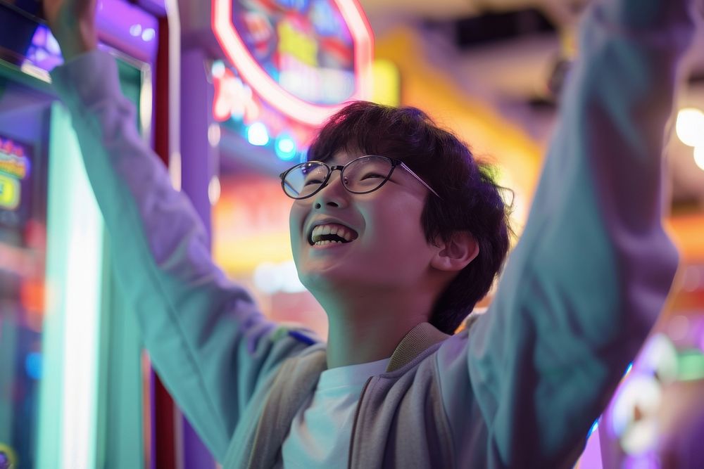 Korean teenager dancing on arcade machine nightlife glasses illuminated.