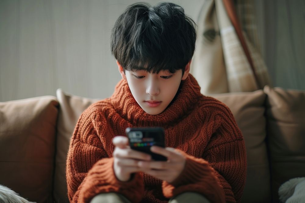 Korean playing mobile phone sweater photo conversation.