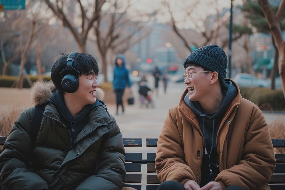 Two Korean talking podcast headset adult men.