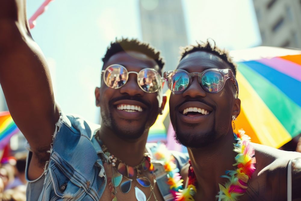 African American gay couple celebrating at a parade carnival glasses adult.
