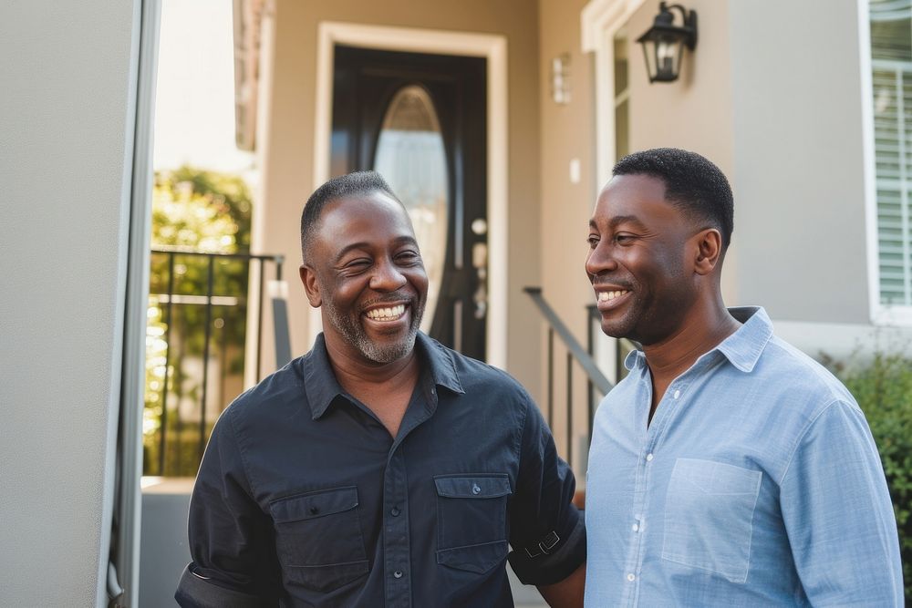 African American Gay Couple Buying New Dream House photography laughing portrait.