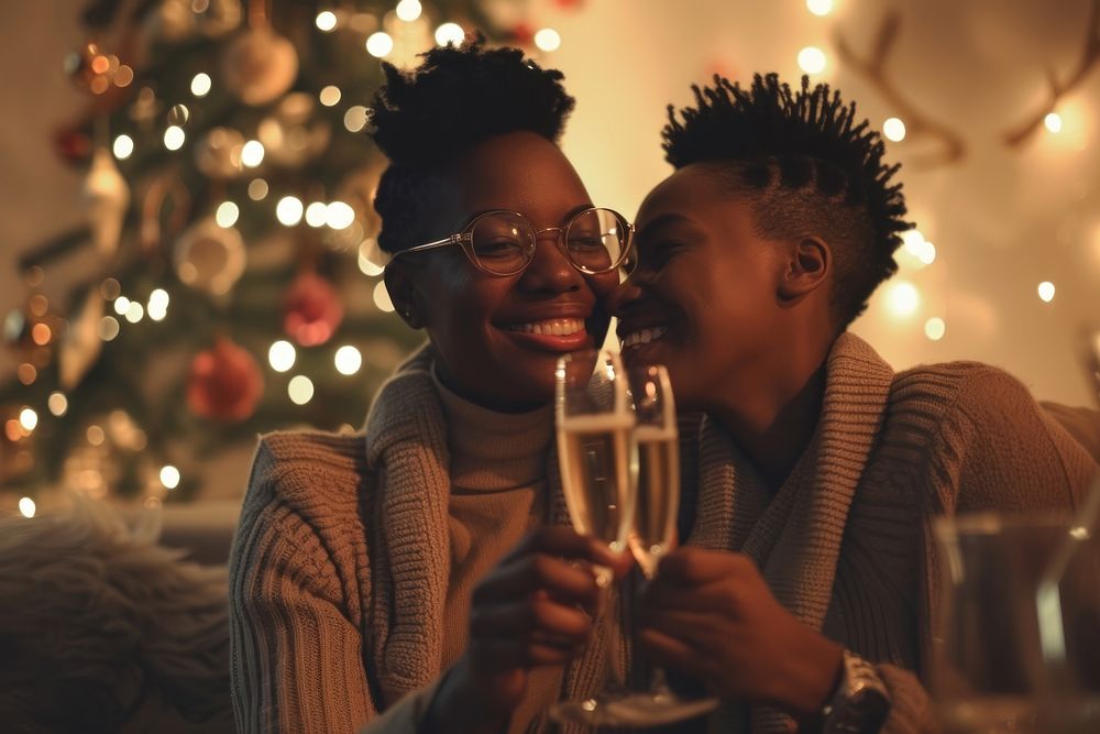 African American lgbt couple champagne drinking smiling.