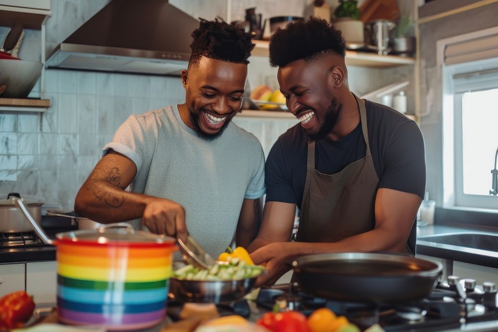 African American lgbtq Couple kitchen cooking adult.