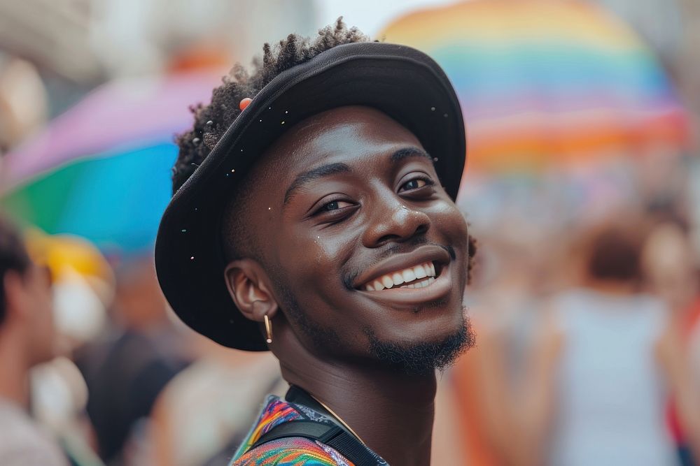 Handsome smiling black skin guy queer at LGBT parade outdoor outdoors smile architecture.