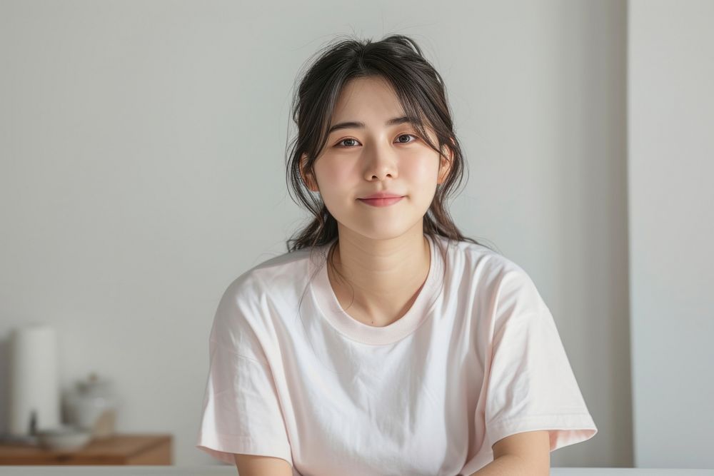 Korean female smiling adult contemplation.