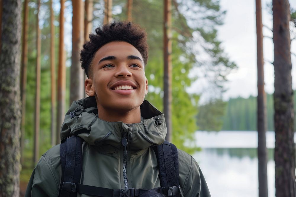 Mixed race teen man outdoors land portrait.