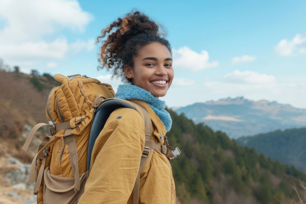 Mixed race teen woman backpack backpacking mountain.