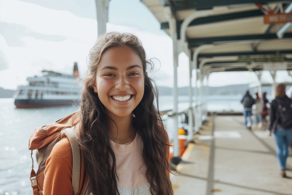 Mixed race teen woman smiling travel smile.