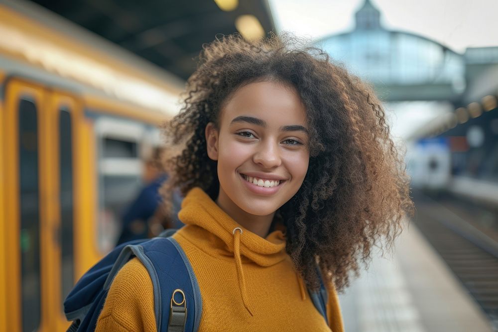 Mixed race teen woman station smiling travel.