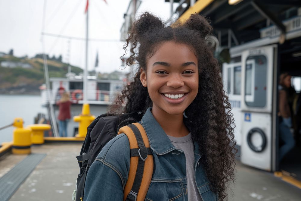 Mixed race teen woman portrait backpack smiling.