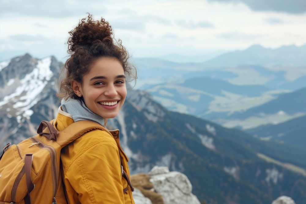 Mixed race teen woman backpack mountain outdoors.