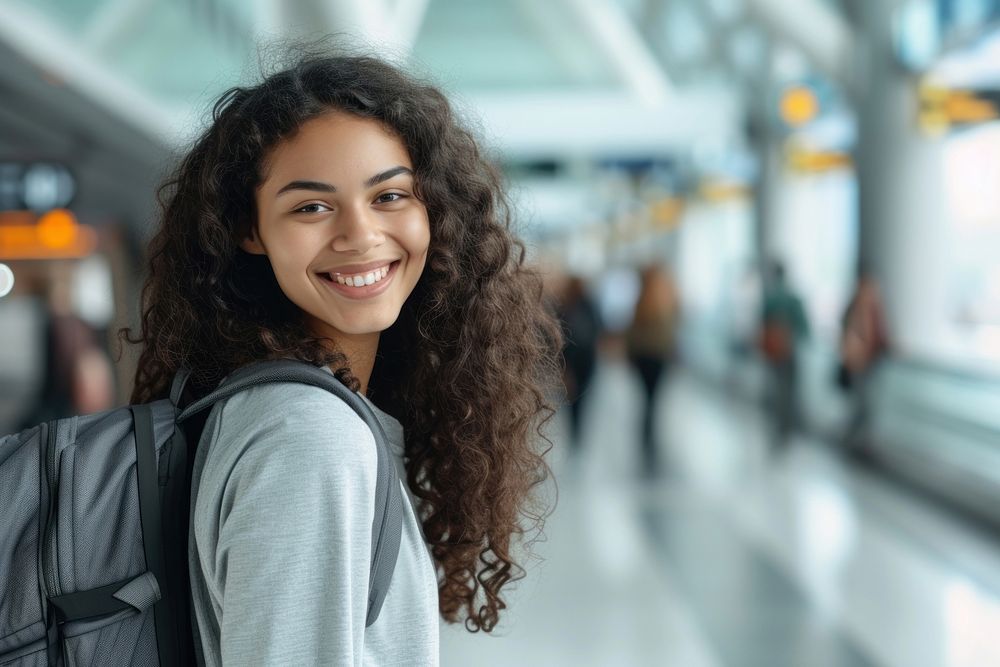 Mixed race teen woman backpack smiling travel.
