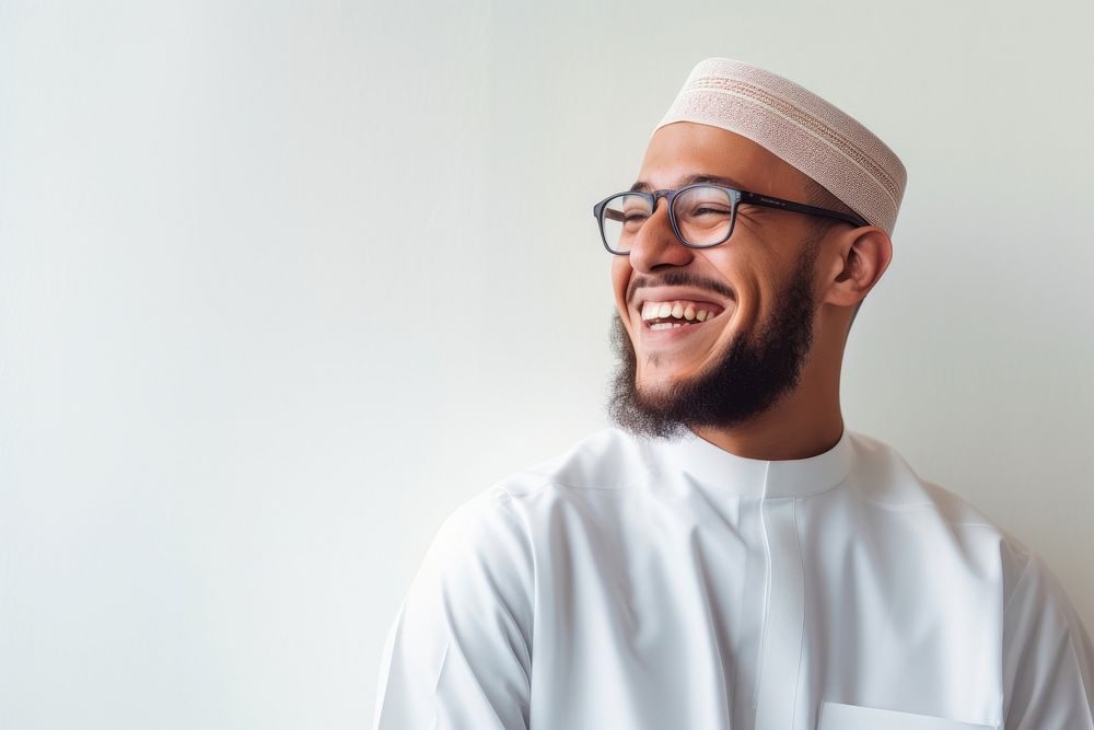 Muslim man wearing glasses and thawb smiling people adult.