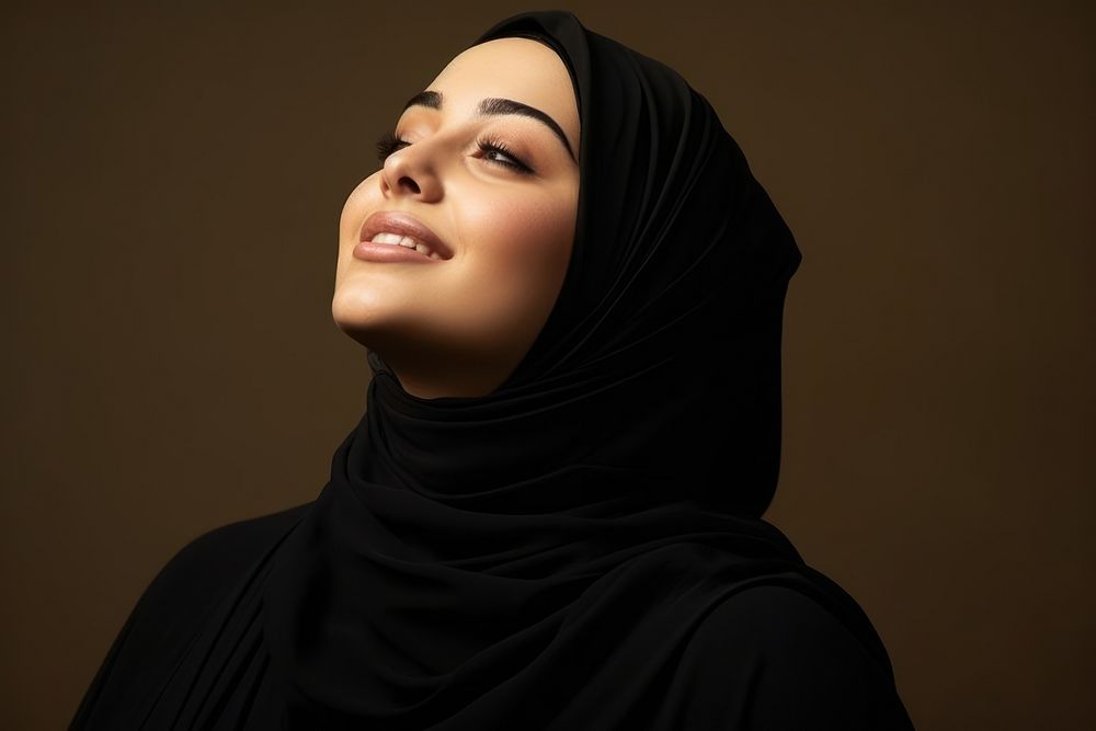 Plus size Middle eastern teen woman in abaya and hijab portrait looking adult.