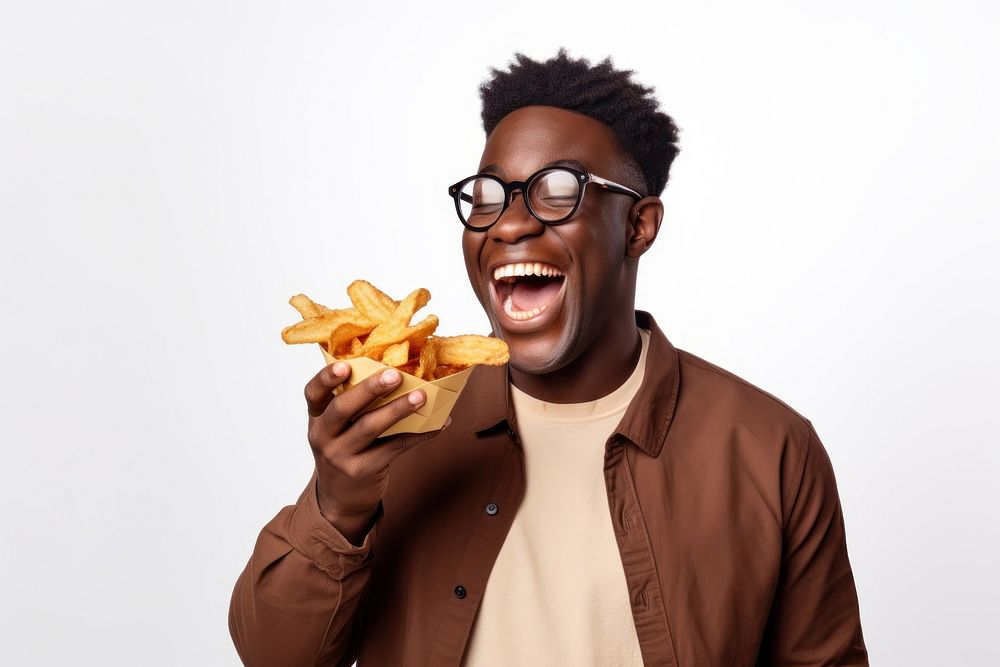 A side view of a man holding plate of chips and biting snack laughing glasses eating. AI generated Image by rawpixel.