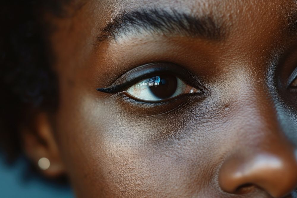 Black woman eyes skin hairstyle forehead.