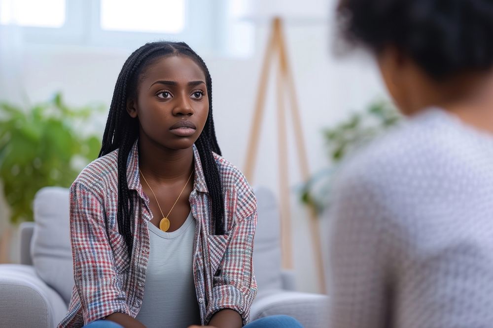Unhappy young black woman conversation contemplation accessories.