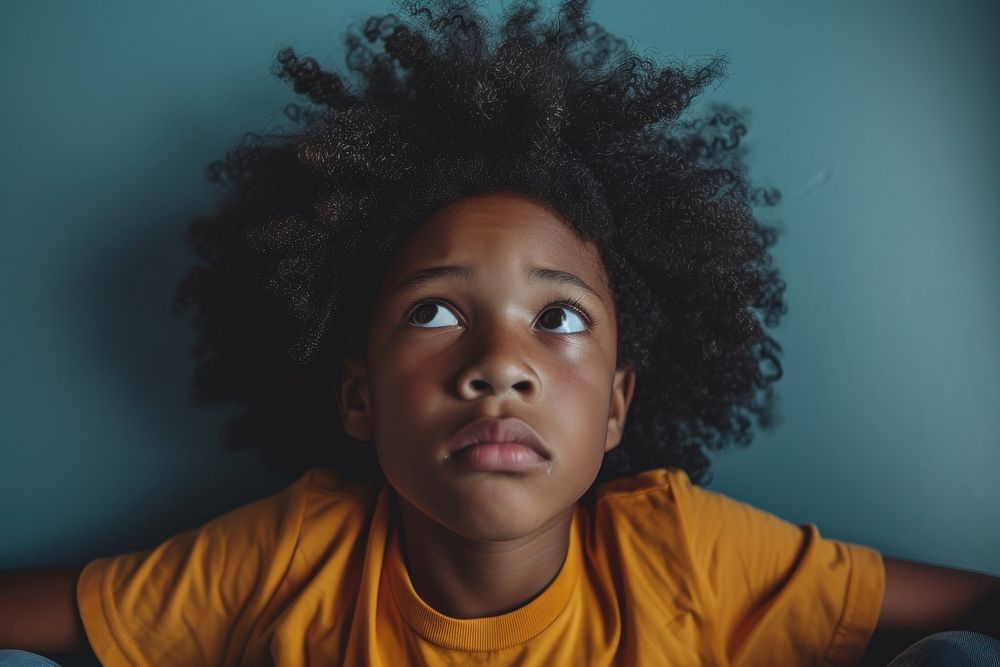 Black kid in anxiety portrait photography dreadlocks.