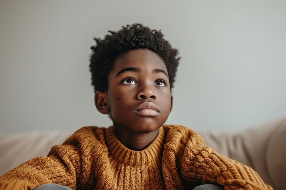 Black kid in anxiety portrait photography sweater.