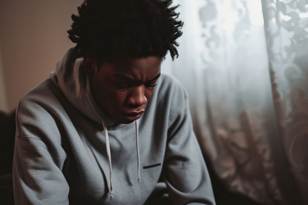 Black teen boy portrait sadness worried.