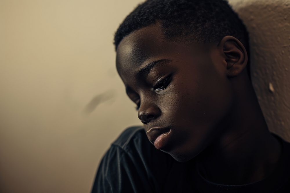 Black teen boy portrait photography sadness.