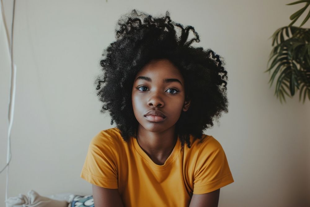 Black teen girl portrait contemplation dreadlocks.