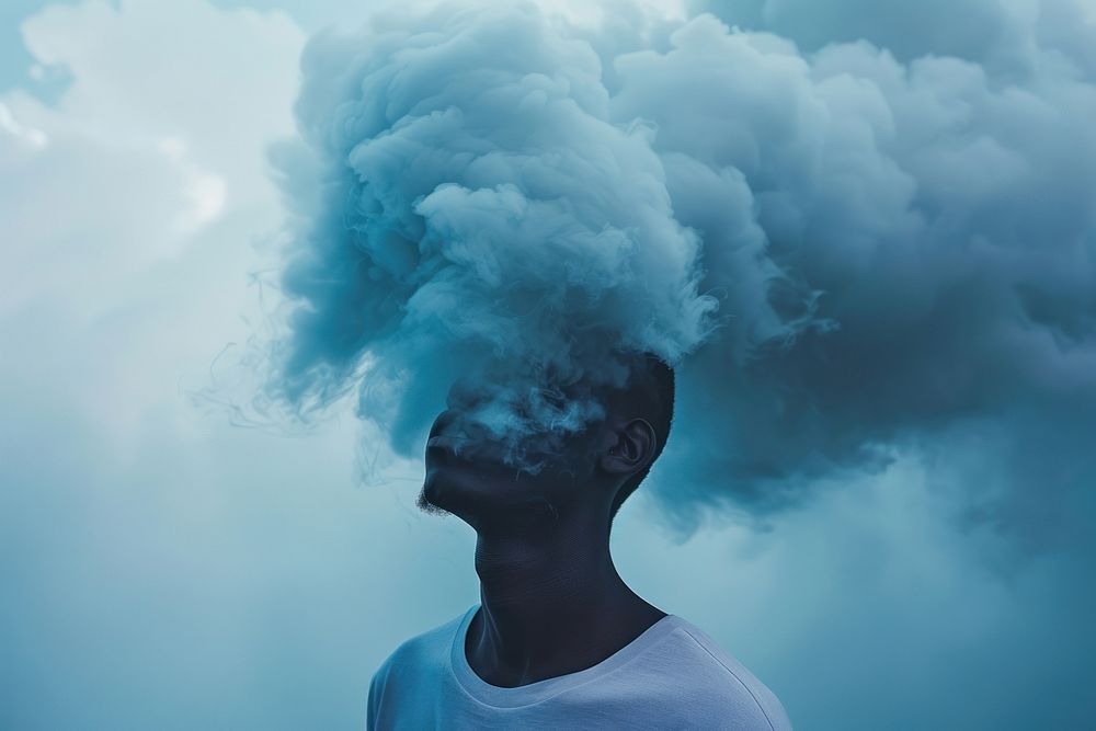 African American man outdoors smoke cloud.