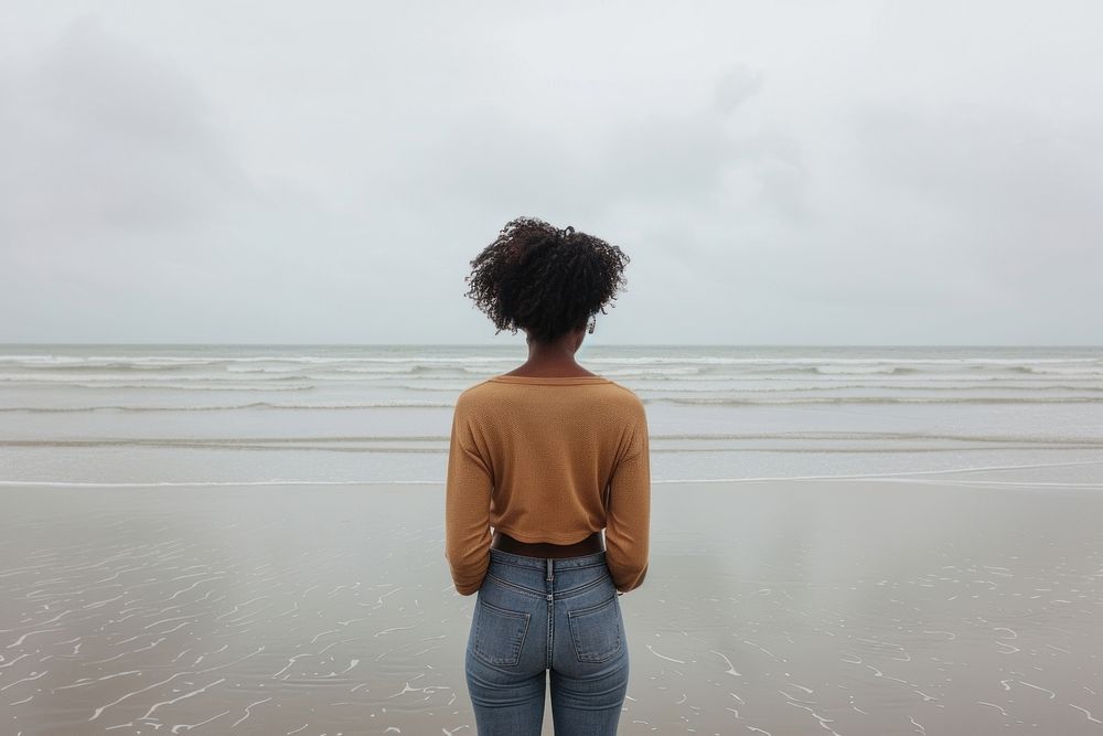 African American young woman standing outdoors horizon.