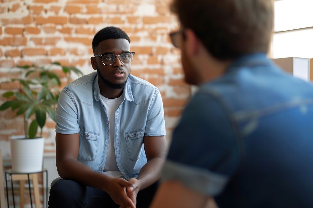 Black man conversation talking therapy.