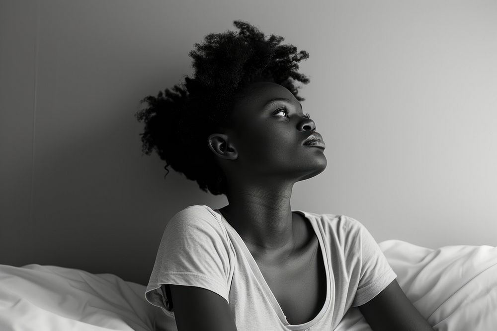 Black woman photography portrait bedroom.