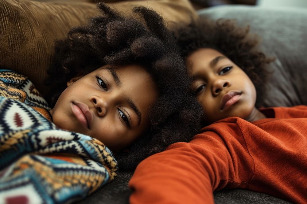 Depressed black kids sofa togetherness affectionate.