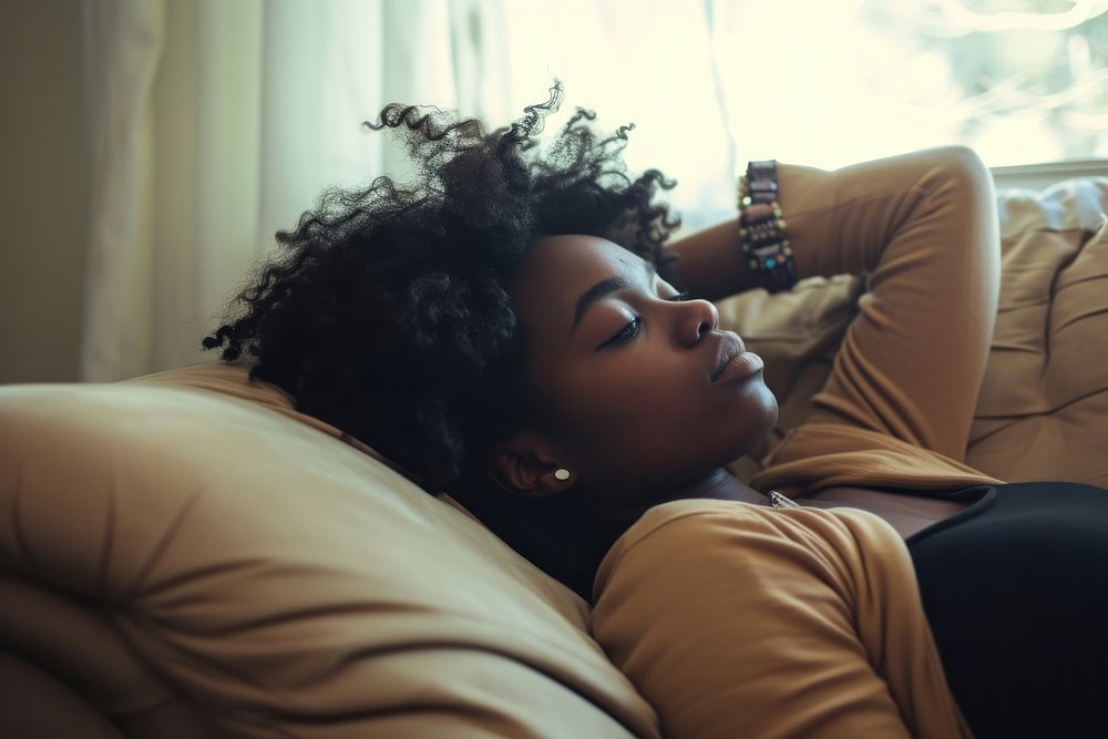 Depressed black woman adult sofa contemplation.