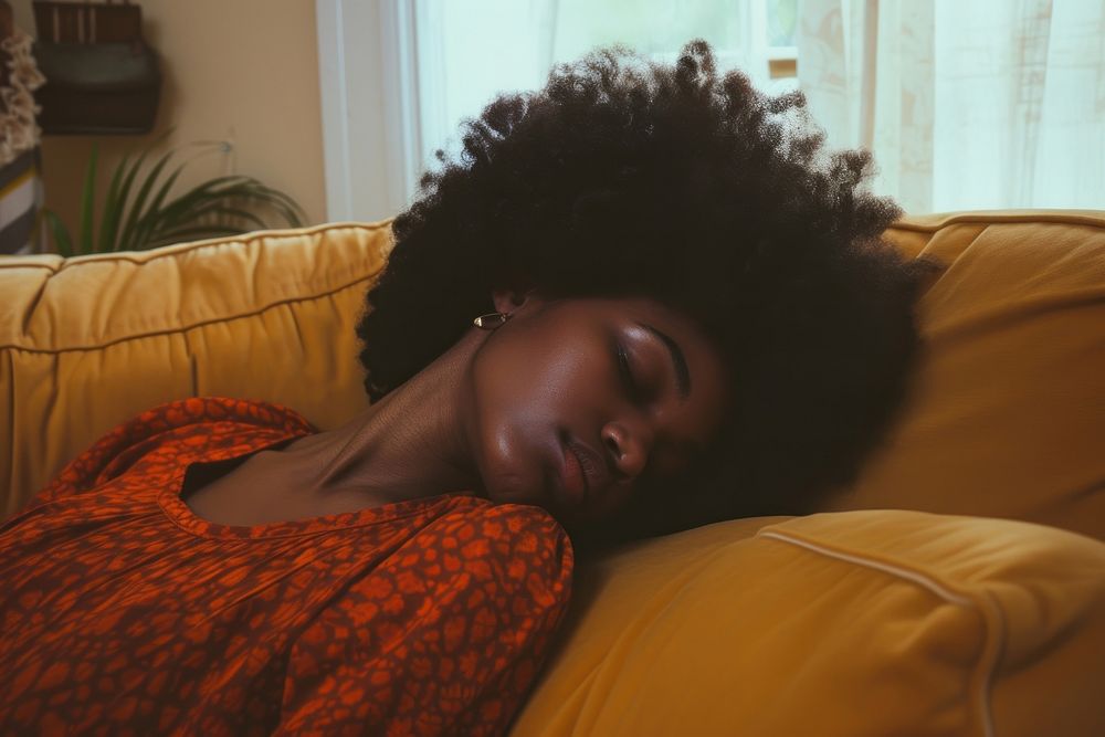 Depressed black woman sleeping sofa comfortable.