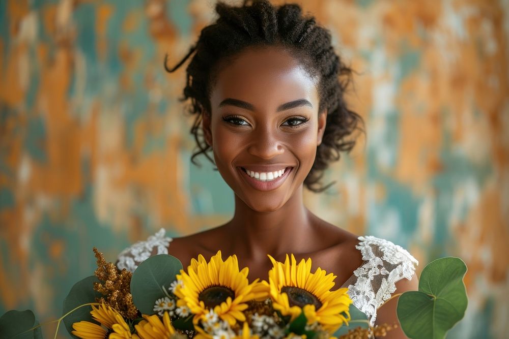 African woman in wedding dress holds a bouquet of sunflowers portrait smiling adult.