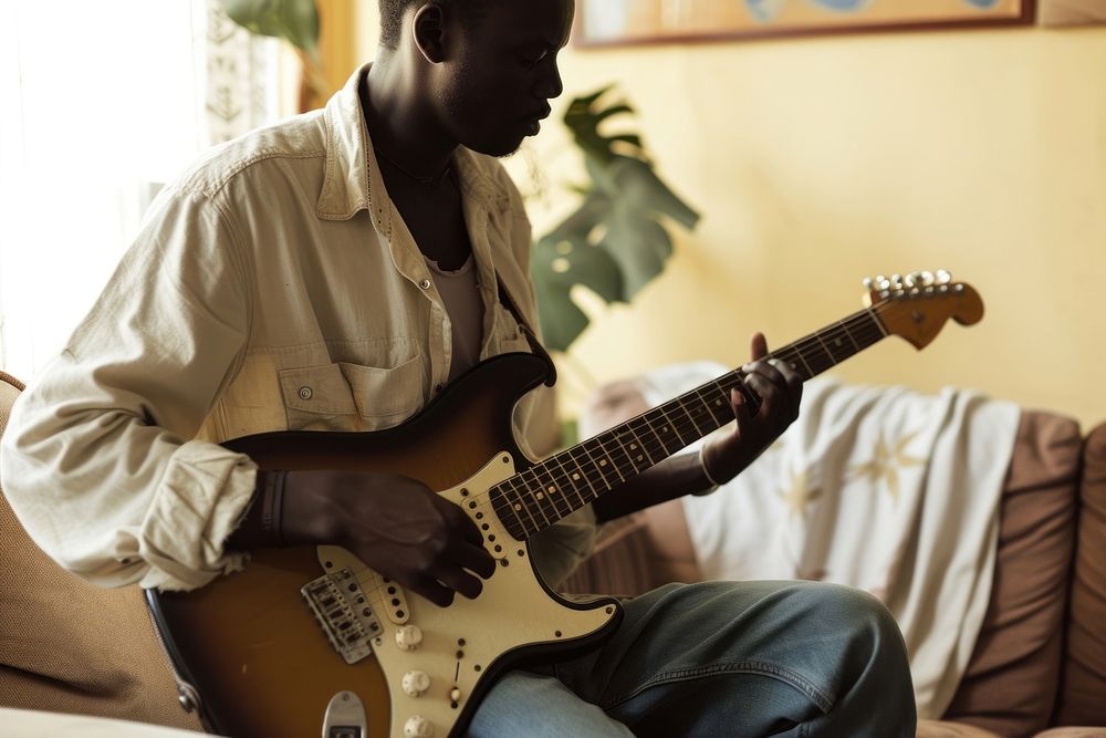 Black South African man guitar musician adult.