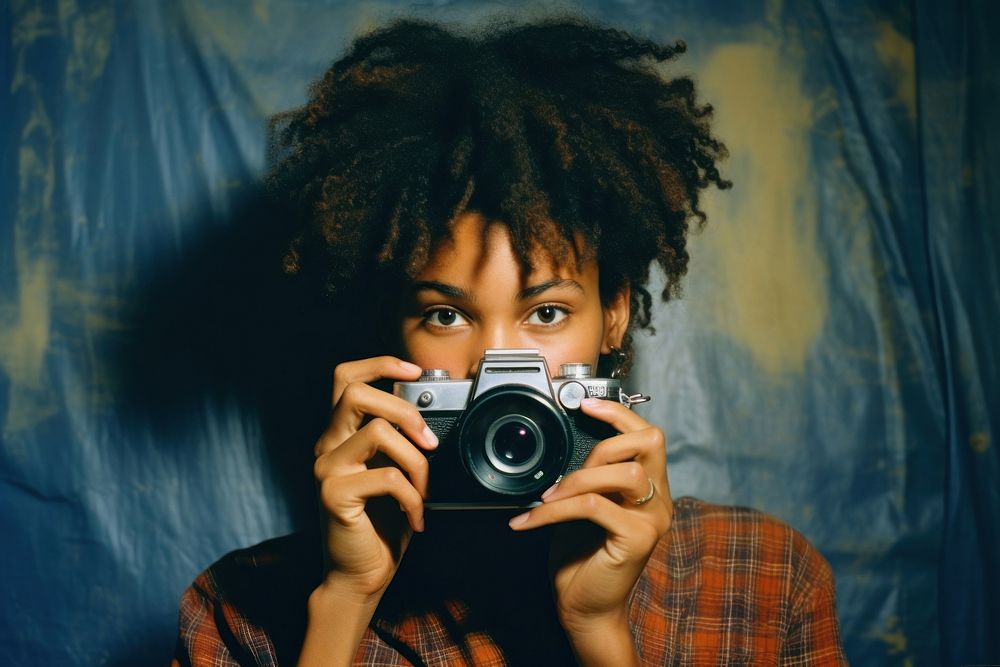 A cool black teenage girl taking a photo photography portrait camera. AI generated Image by rawpixel.