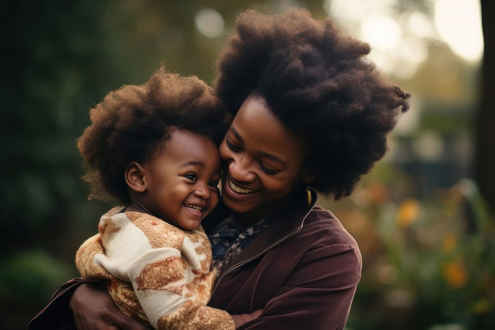 African mother holding her baby photography laughing portrait.