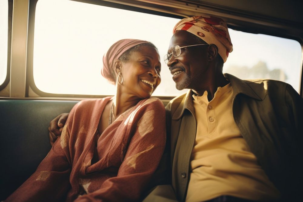 African mid-ages couple standing in bus photography portrait glasses.