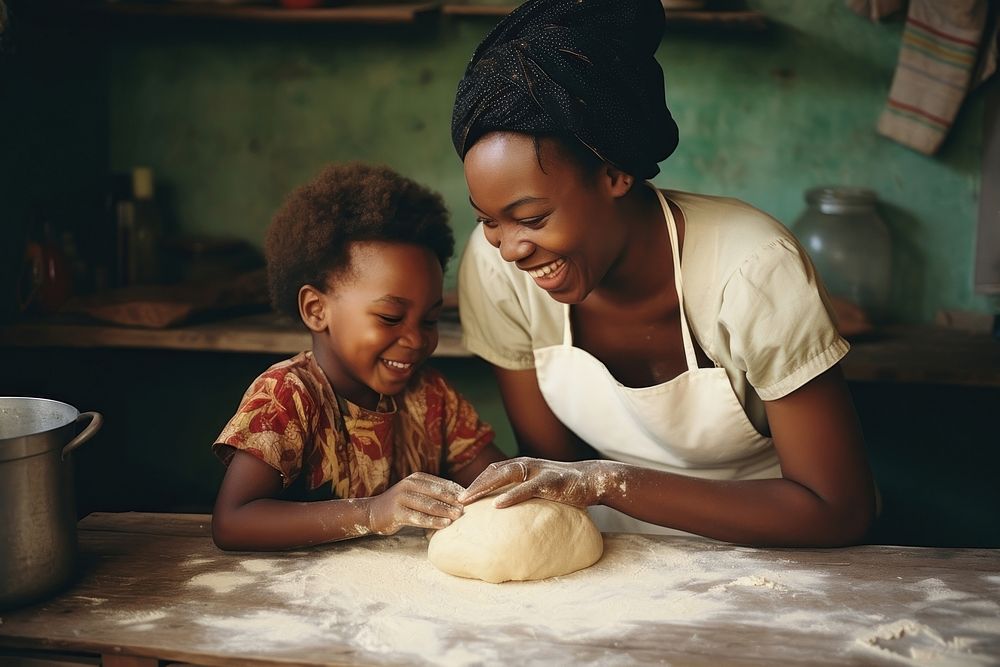 African mom and kid making bakery adult.