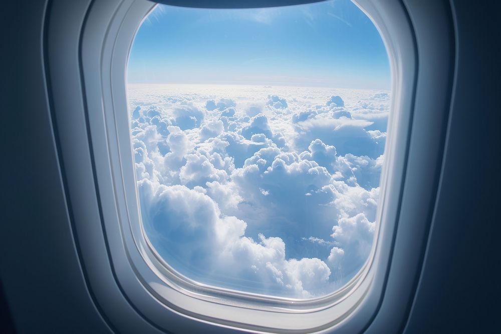 Large window see raining cloudscape airplane porthole vehicle.