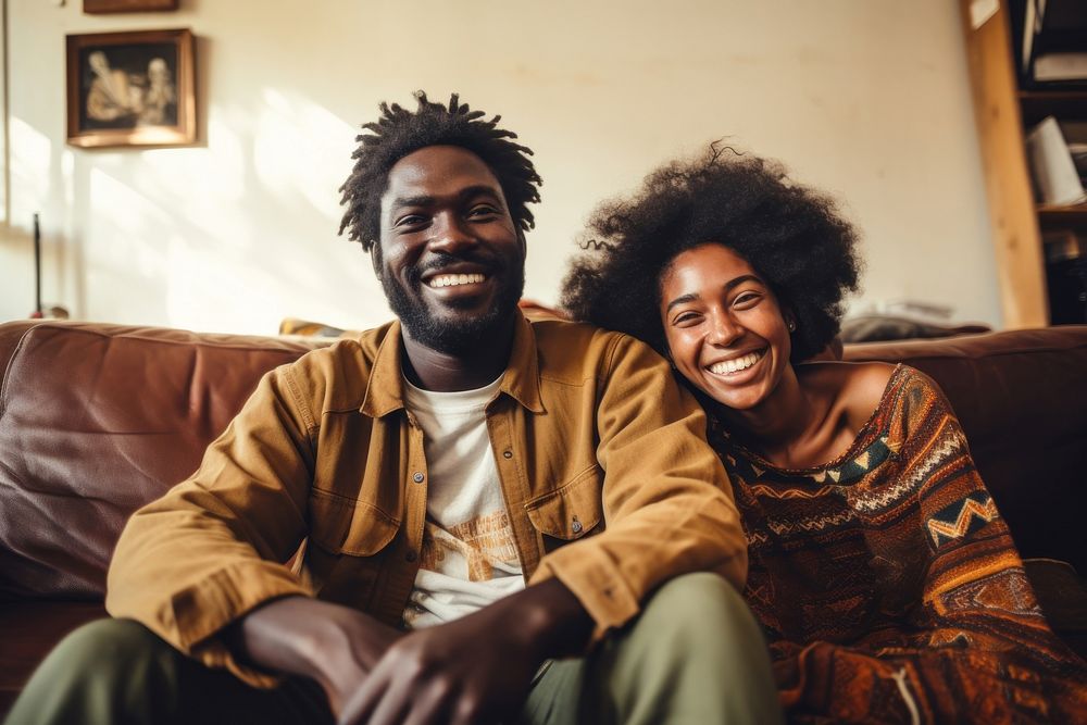Happy African man and girlfriend laughing sitting adult.