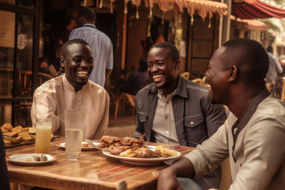 Happy African men eating adult togetherness.
