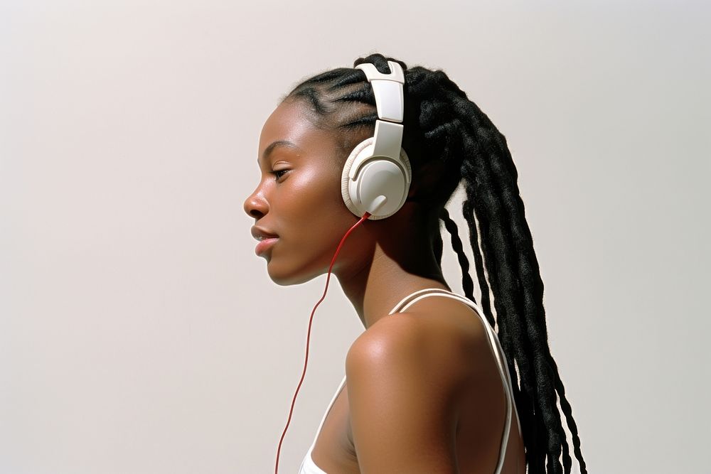 African-American woman wearing headphone listening to music headphones headset adult.